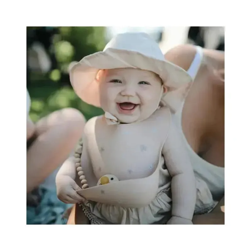 mushie__babete_de_silicon_SKUbAe5xd3F_2.webp Mushie - Babete de silicone para bebê - Daisy Outlet