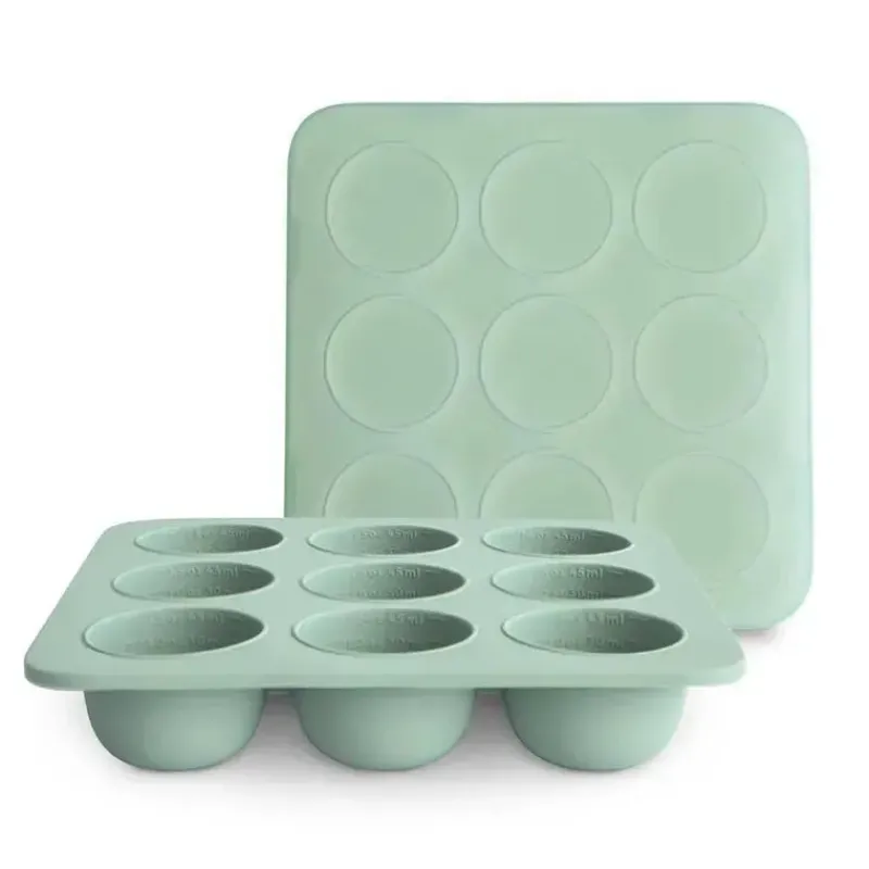 mushie__bandeja_de_silico_SKUSRJDo5nI_0.webp Mushie - Bandeja de silicone para freezer de comida para bebê com tampa, 9 xícaras de 1,5 onças, Cambridge Blue Best