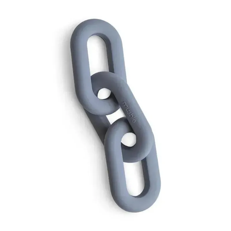 mushie__brinquedo_de_mord_SKU6iY9oDb8_0.webp Mushie - Brinquedo de mordedor de silicone para bebês, Tradewinds Outlet