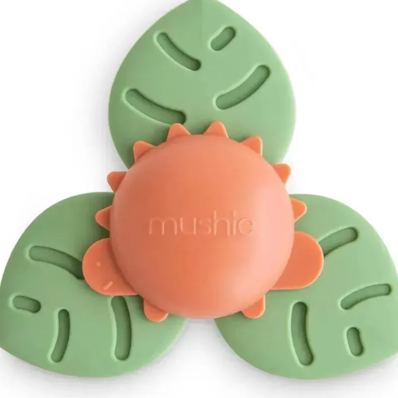mushie__brinquedo_giratri_SKUoHa1o6IR_0.webp Mushie - brinquedo giratório de sucção Dino para banho e brincadeira Hot