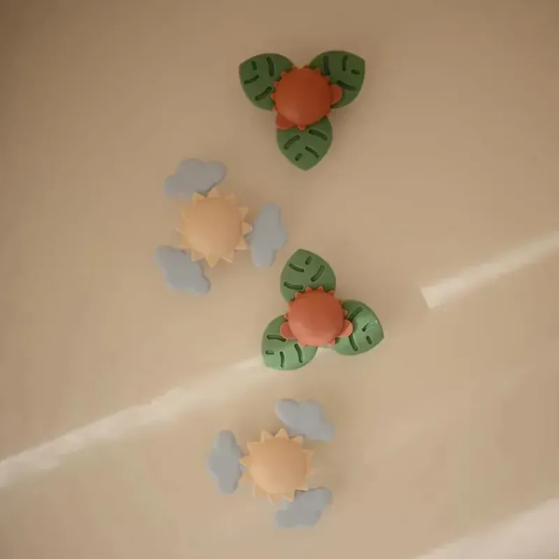 mushie__brinquedo_giratri_SKUoHa1o6IR_1.webp Mushie - brinquedo giratório de sucção Dino para banho e brincadeira Hot
