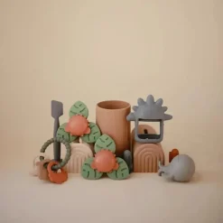 Mushie - brinquedo giratório de sucção Dino para banho e brincadeira Hot