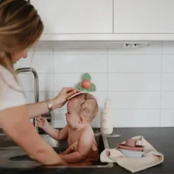 Mushie - brinquedo giratório de sucção Dino para banho e brincadeira Hot