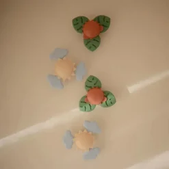 Mushie - Brinquedo giratório de sucção Sunshine para banho e brincadeira Outlet
