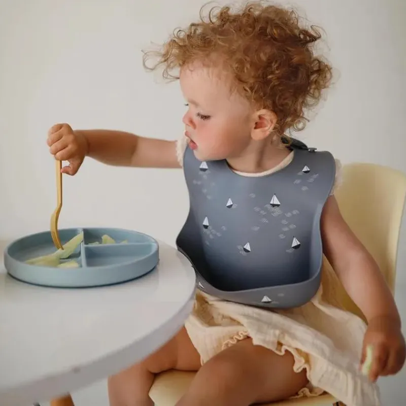 mushie__silicone_baby_bib_SKU1mxzmqM7_3.webp Mushie - Silicone Baby Bib, Planets Sale