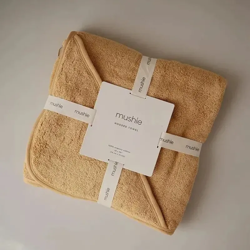 mushie__toalha_de_algodo__SKUpYXW2NE9_1.webp Mushie - Toalha de Algodão Orgânico para Bebês, Amarelo Outono Clearance