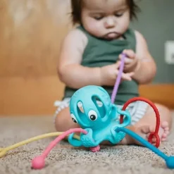 Nuby - Brinquedo interativo polvo 100% silicone com cordão Best