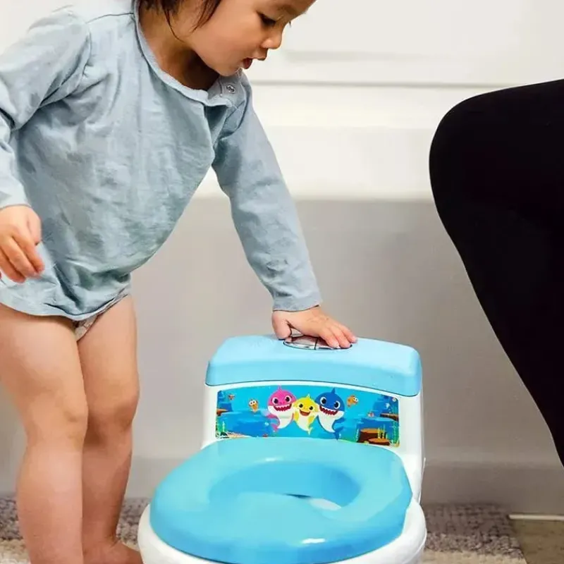 sistema_de_penico__em__to_SKUaKpi4wtQ_3.webp Tomy Sistema de penico 2 em 1 Baby Shark New